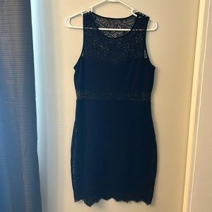 Black lace sleeveless bodycon dress.